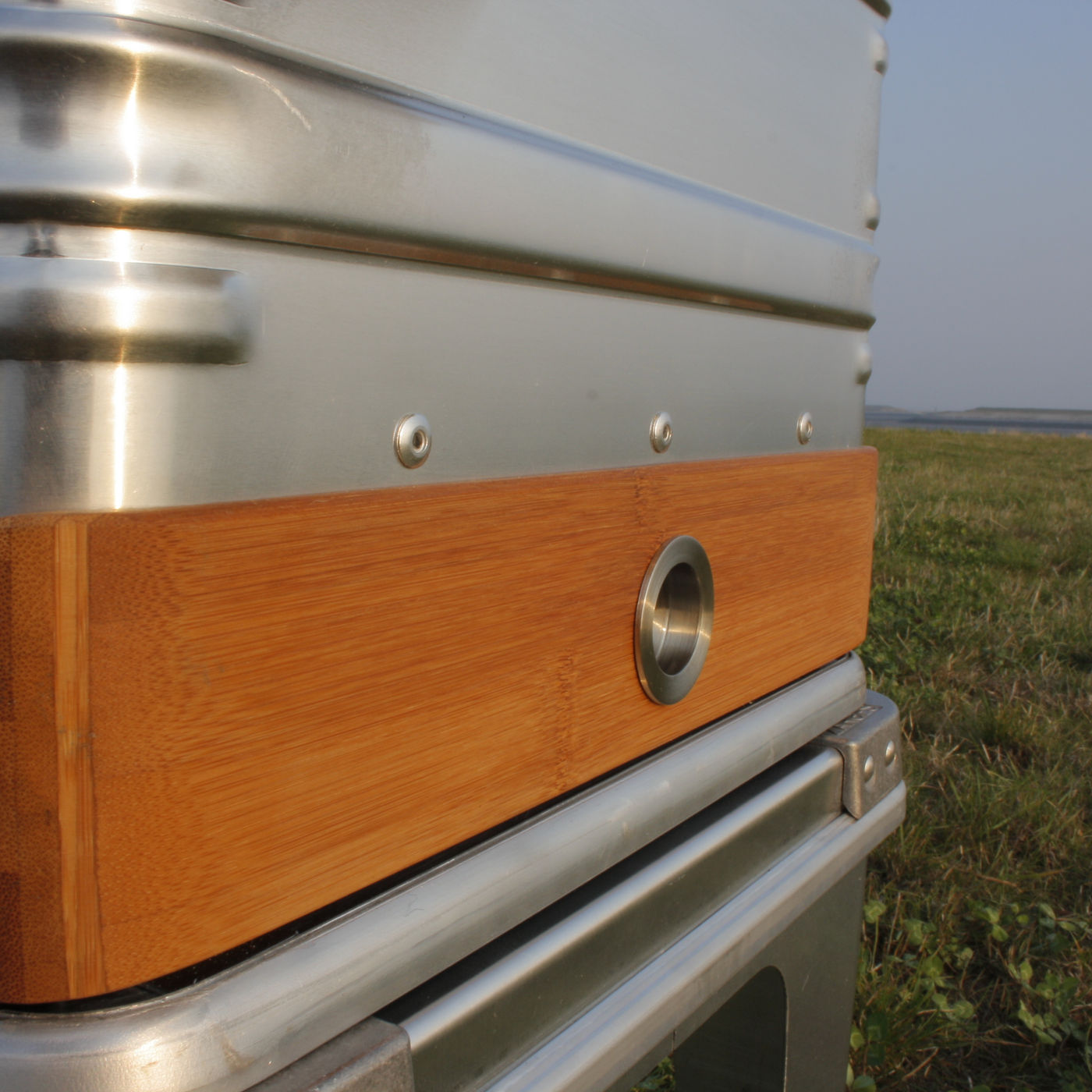 Recessed stainless finger pull on the bamboo drawer